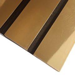 Modern interior featuring gold wide slat acoustic wall panels, size 30x240 cm, designed to enhance sound absorption and add a stylish touch, available in the solid furniture UK.