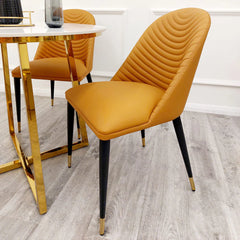 Alba Tan Leather Dining Chair styled with a dining table for contemporary interiors by Solid Furniture UK