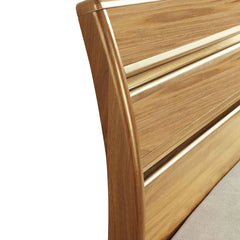 Close-up of High Gloss Alexandra Oak bed frame headboard with curved rails by Solid Furniture UK
