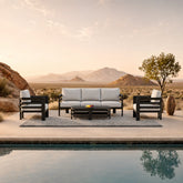 Andros 5 seater outdoor garden lounge set styled in a UK garden at sunset from Solid Furniture UK
