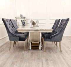 Side view of Arial marble dining table with chrome base and Majestic velvet dining chairs modern dining set Solid Furniture UK