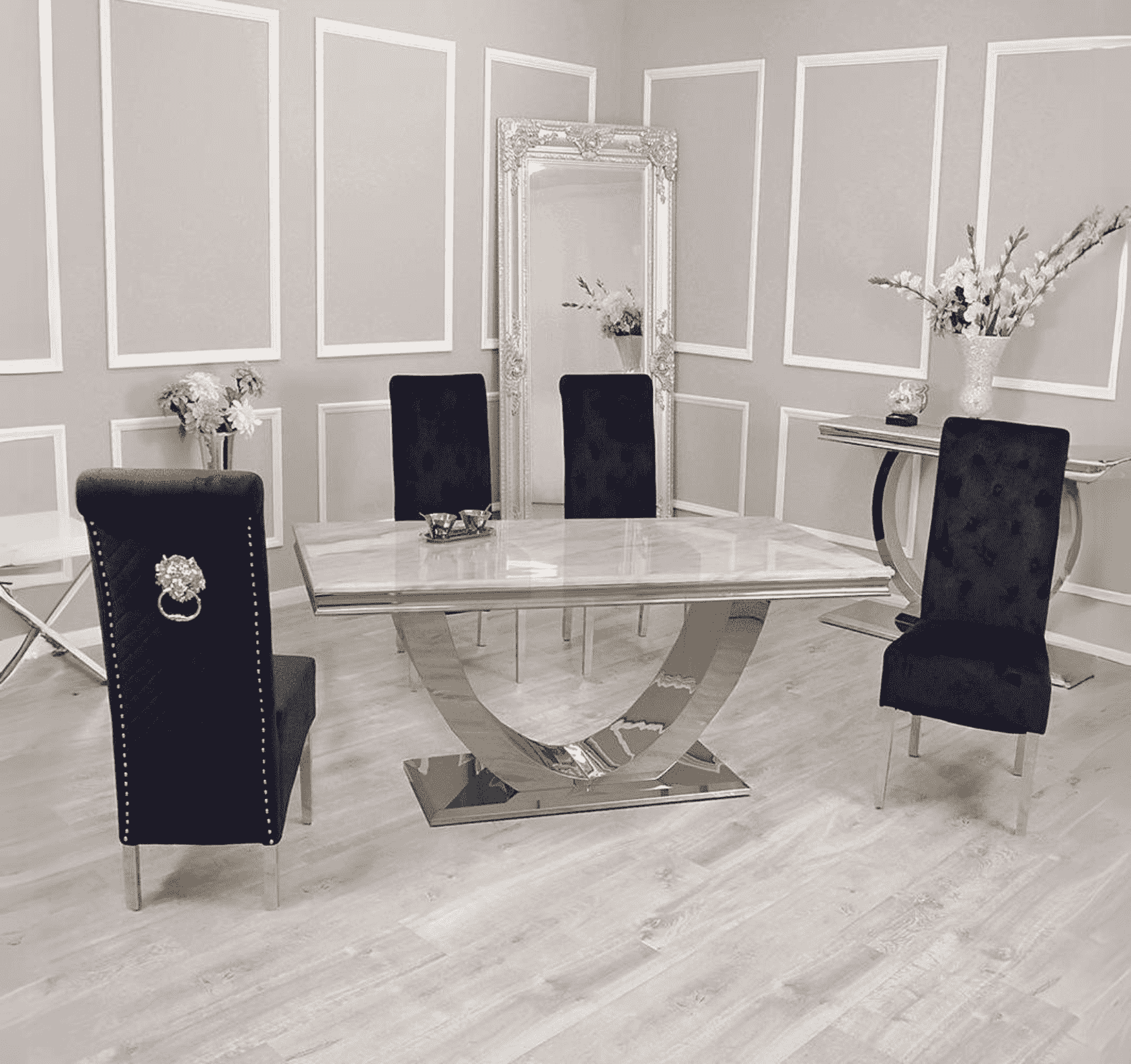 Arial white marble dining table with Sofia black velvet chairs set by Solid Furniture UK in a modern dining room