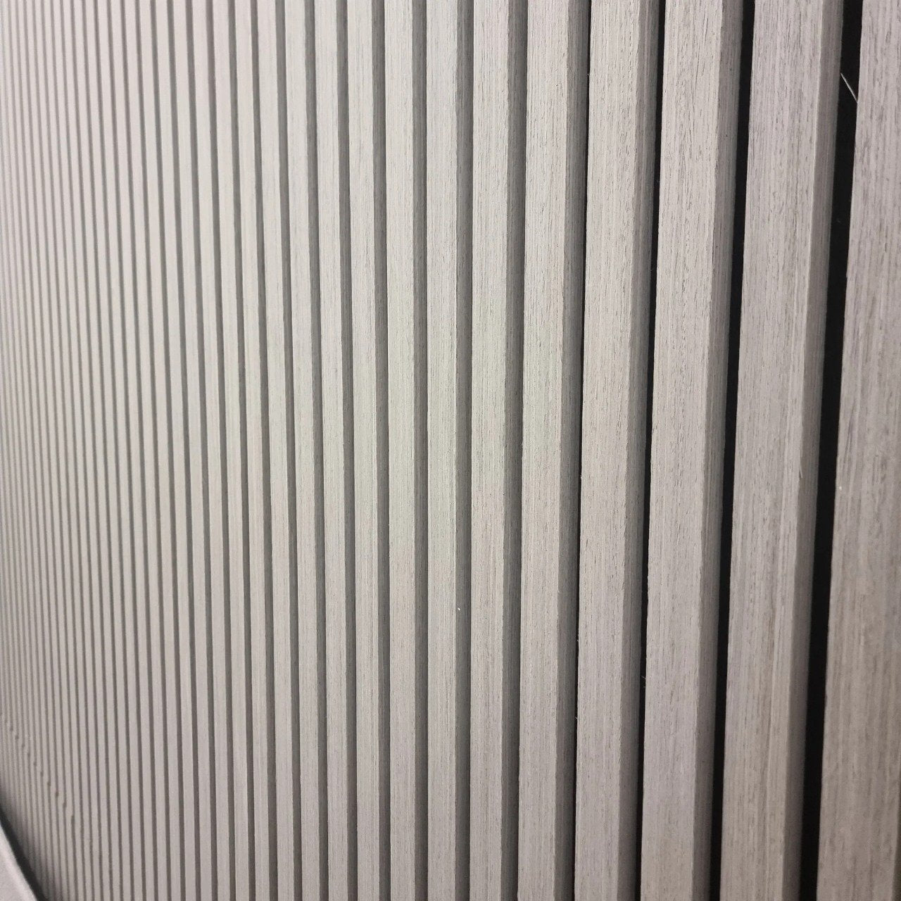 Side view of Ash Grey 60x240cm wall panel by Solid Furniture UK showing thickness, slat structure, and acoustic backing detail
