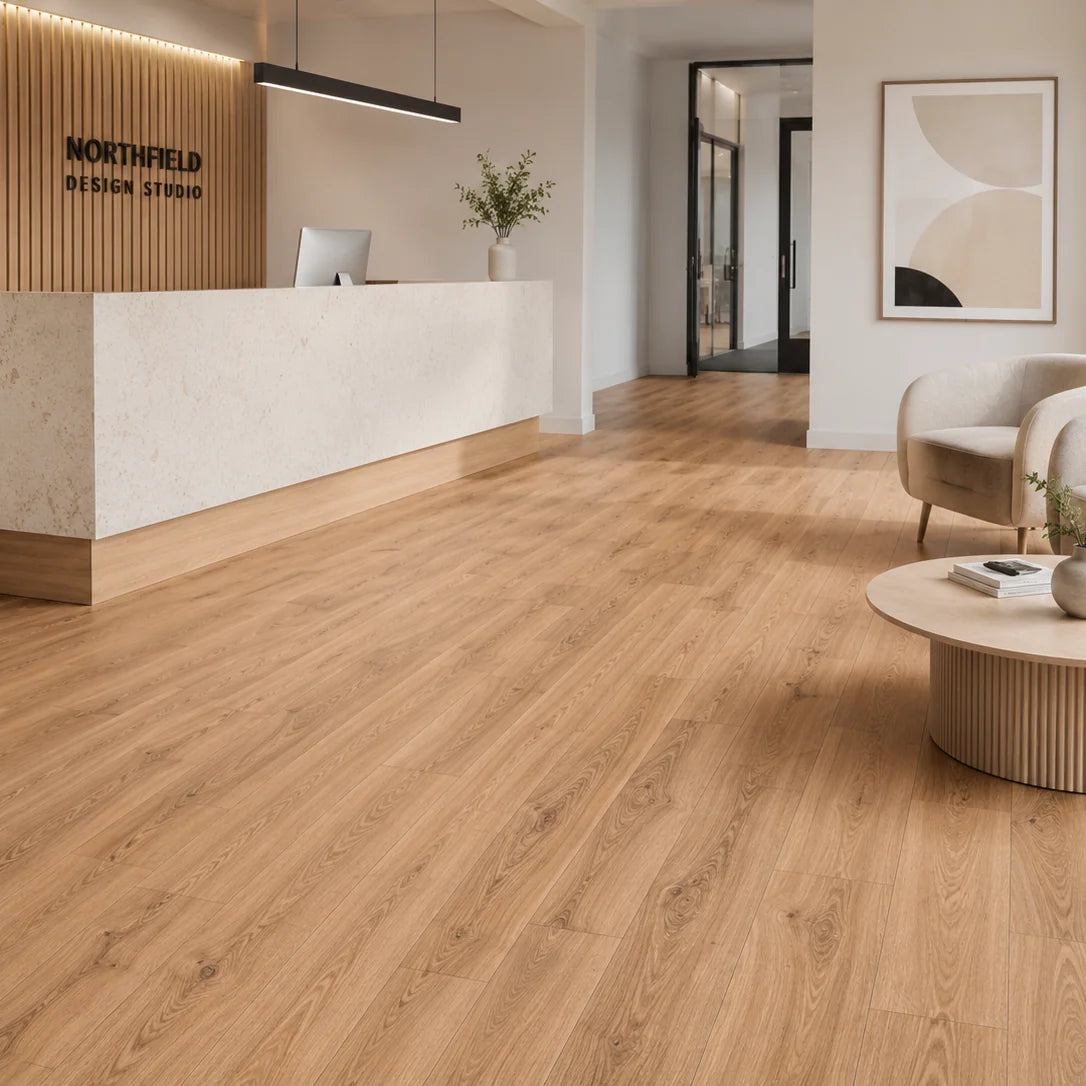 Aurevia Honey Oak luxury vinyl flooring fitted in a modern interior setting by Solid Furniture UK