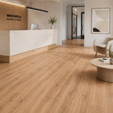 Aurevia Honey Oak luxury vinyl flooring fitted in a modern interior setting by Solid Furniture UK