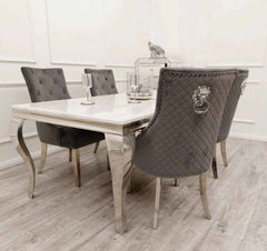 Dark grey Bentley chrome velvet dining chair UK styled with dining table in modern UK dining room setting from Solid Furniture UK