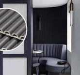 Black fluted WPC wall panels installed on a living room feature wall by Solid Furniture UK for a modern interior upgrade