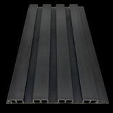 Black seamless WPC outdoor wall panels close-up showing the decorative slatted profile – Solid Furniture UK