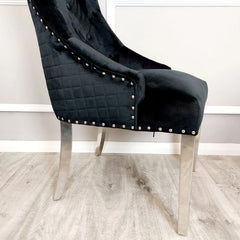 Black velvet Bentley dining chair UK right side view by Solid Furniture UK showing chrome legs and curved side profile design
