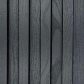 Close-up view of black WPC wall panels from Solid Furniture UK showing waterproof structure, durable composite material, and smooth surface finish for modern interior wall cladding.