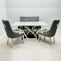 Front view of California Grey Marble Dining Table with chairs arranged around it in a stylish modern dining room setup solid furniture UK