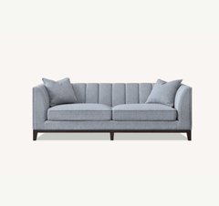 Front-side view of Cooper 3 seater sofa in dolphin grey bouclé fabric with deep cushions solid furniture UK