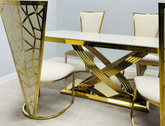Side view of cream and gold marble dining table with gold base and dining chairs modern luxury furniture UK by Solid Furniture UK