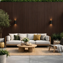 Modern outdoor patio featuring dark brown slatted composite wall cladding, 16×240cm, pack of 12, by Solid Furniture UK