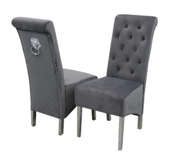 Dark grey Emma velvet dining chair UK main view featuring scroll-back design, buttoned quilting, chrome lion knocker, and chrome legs from Solid Furniture UK.