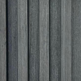 Close-up detail of dark grey WPC wall panel UK by Solid Furniture UK showing stone-effect texture and seamless waterproof surface finish for modern interiors.