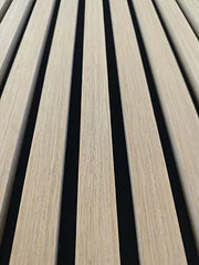 Angled view of dark oak HDF acoustic slatted wall panels 60x240cm by Solid Furniture UK in the UK highlighting depth, texture, and modern design.