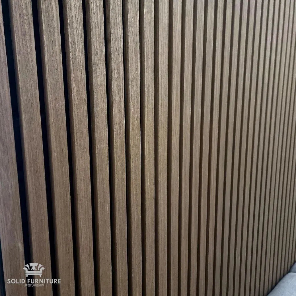 Angled view of Dark Oak 60x240cm acoustic wall panels by Solid Furniture UK highlighting slat depth and premium wood finish