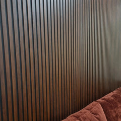 Dark oak waterproof slatted WPC wall panels 15x240cm installed in living room – Solid Furniture UK