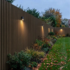 Dark oak WPC wall panels installed in a garden feature area – Solid Furniture UK