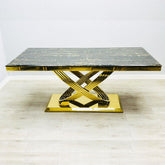 Elina gold marble dining table in black and gold finish shown in main front view with rectangular design and modern luxury style. solid furniture UK