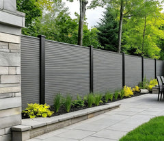 Grey Oak Composite Fence Panels by Solid Furniture UK installed around a modern patio outdoor space