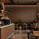Grid Acoustic Wall Panels 120cm x 30cm installed as a feature wall in a restaurant UK by Solid Furniture UK, modern acoustic wood design interior