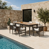 Hemera 6 seater outdoor garden dining set with dining table and chairs, modern aluminium patio furniture set with swimming pool view in a luxury garden setting solid furniture UK
