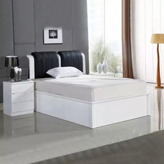 High Gloss Rugby Ottoman Storage Bed in White with Black Leather Upholstered Headboard Main View by Solid Furniture UK