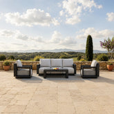 Ikos Onyx 5 Seater outdoor garden lounge sofa set with mountain hills view in the background, modern aluminium patio furniture for stylish UK gardens solid furniture UK