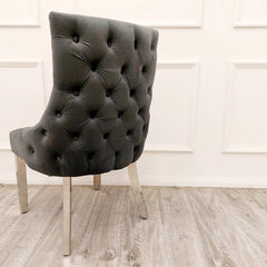 Back side view of Kensington dark grey fabric dining chairs with deep button tufted design and chrome legs UK