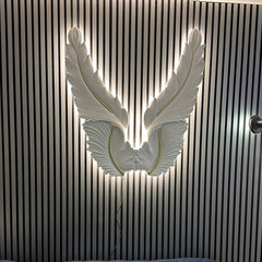 LED Angel Wings Decorative Wall Art mounted on premium wall panels by Solid Furniture UK, creating a stunning illuminated feature wall for modern interiors.