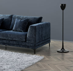 Side view of Lenox Aegean blue velvet sofa with clean mid-century lines and wooden plinth base solid furniture UK