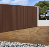 Light brown WPC outdoor wall panels 180cm and 290cm installed in a modern UK garden setting by Solid Furniture LTD, showcasing warm and stylish exterior wall design