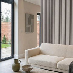 Light grey WPC slatted wall panel 30x240cm installed in living room – Solid Furniture UK