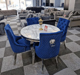 Luxury dining set close-up detail by Solid Furniture UK showing marble table surface and navy velvet chair craftsmanship