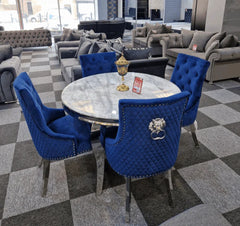 Luxury dining set close-up detail by Solid Furniture UK showing marble table surface and navy velvet chair craftsmanship