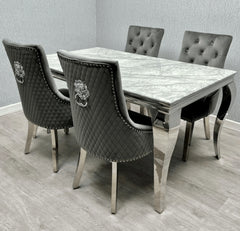 Side angle view of Louis Silver Grey marble effect dining table with grey Majestic velvet chairs from Solid Furniture UK
