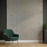 Marble-white slatted wall panels installed in a modern hallway, showing slim vertical slats, subtle marble-white finish, and acoustic functionality in a bright, minimalist space. solid furniture UK