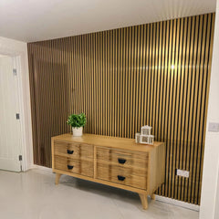 Front view of metallic gold acoustic wall panel 60x240cm UK with clean modern slatted pattern. solid furniture UK