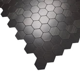 Close-up of black mini hexagon mosaic wall tiles 30 x 30cm pack of 10 by Solid Furniture LTD highlighting texture and pattern