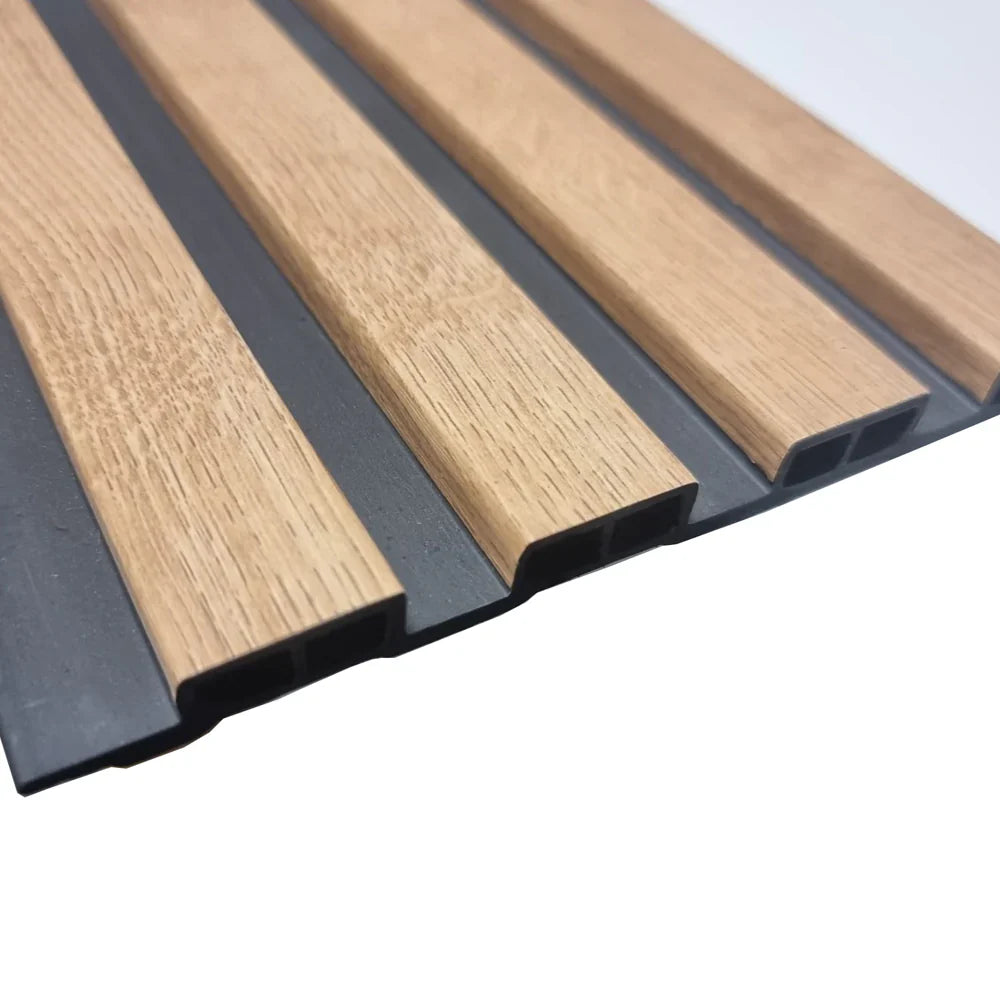 Close-up of oak-effect WPC wall panels 30x240 cm UK by Solid Furniture UK showing realistic wood grain texture and slatted detail
