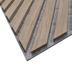 Close-up detail of oak veneer horizontal and diagonal slats on acoustic wall panel by Solid Furniture showing wood grain texture and grey felt backing in a UK interior.