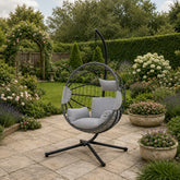 Outdoor hanging egg chair in light grey finish ideal for garden seating and leisure spaces solid furniture UK