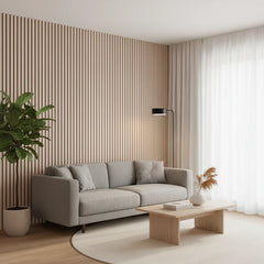 Premium Oak acoustic slatted wall panels installed in a modern living room, showcasing a warm wood finish and enhanced interior design with sound-absorbing features. solid furniture UK