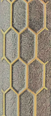 Close up of quartz print brown acoustic wall panel 60x240cm showing textured surface and 3D gold line detail. solid furniture UK