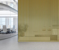 Shiny gold acoustic slatted wall panel on a modern interior feature wall solid furniture uk