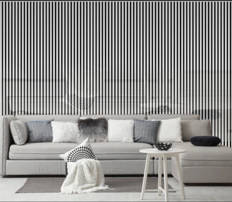 Shiny silver acoustic slatted wall panel installed on a modern interior feature wall solid furniture uk