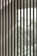 Close-up of shiny silver wall panels 60x240 by Solid Furniture UK highlighting HDF slats, spacing, and polished metallic surface