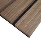 Close-up view of wide slat 3-sided wood veneer acoustic wall panel in premium walnut finish highlighting detailed texture and contemporary slat design solid furniture UK